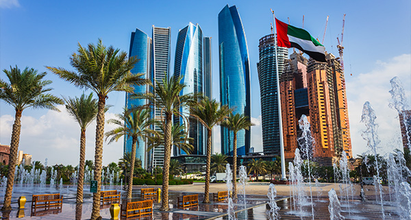 skyscrapers in the background of a fountain park in Dubai, UAE